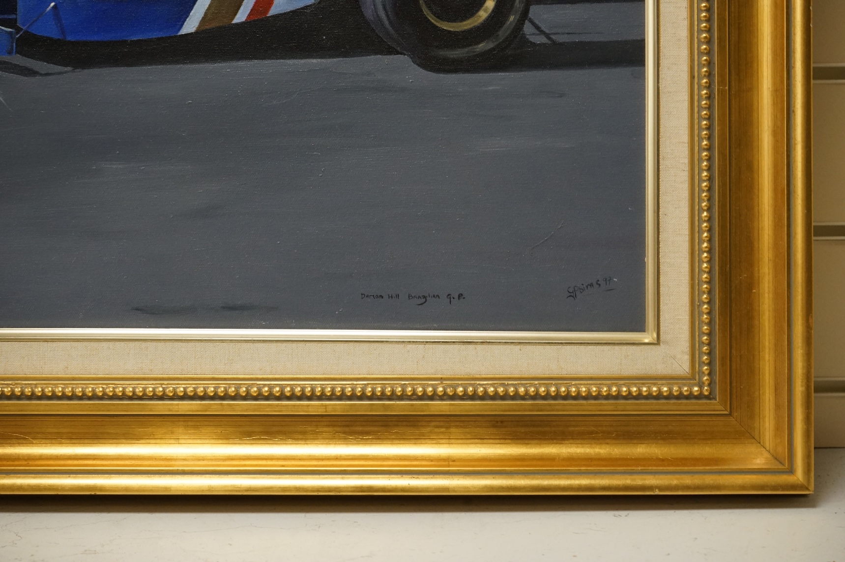 Sims, oil on canvas, ‘Damon Hill, Brazilian Grand Prix’, signed and dated '97, 50 x 74cm, gilt frame
